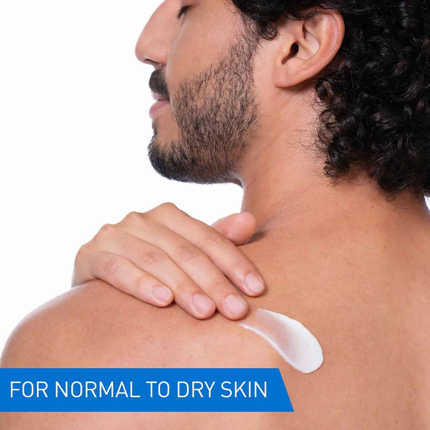 Man applying cream to his shoulder with a focus on normal to dry skin.