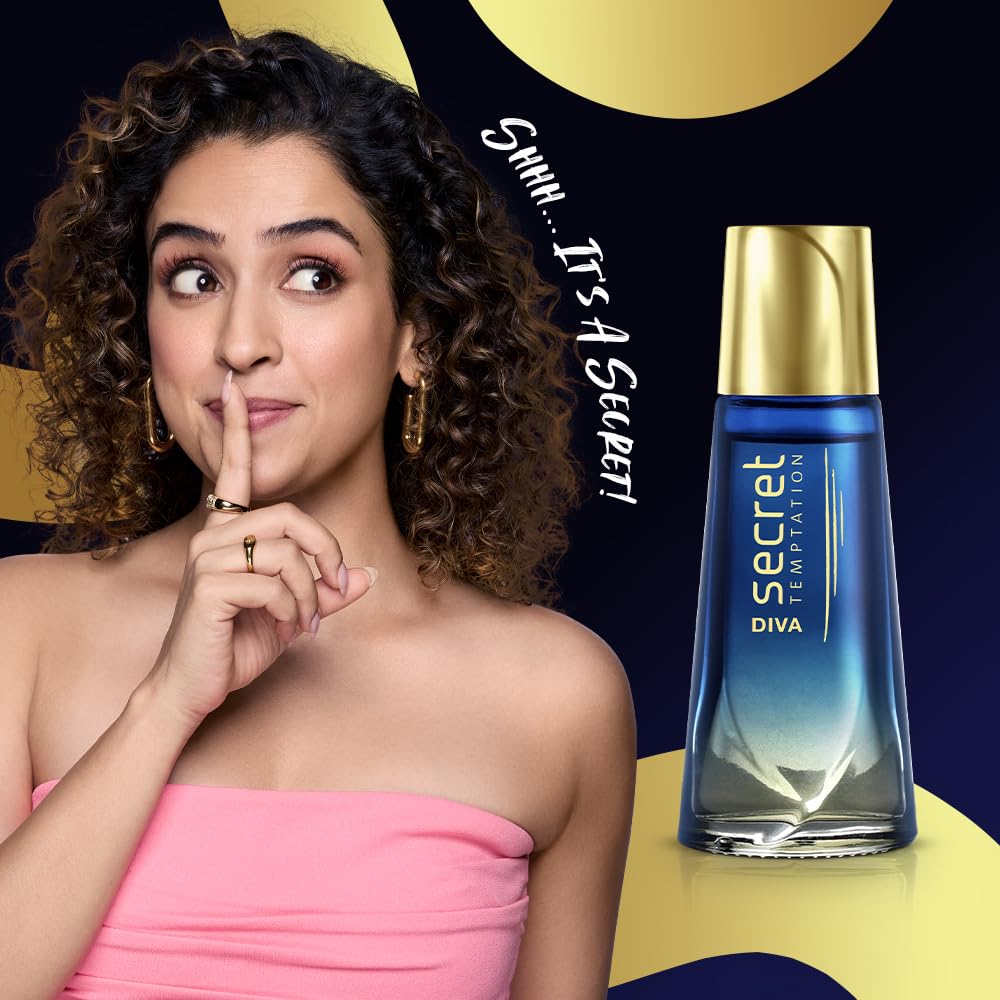 Woman in pink dress with curly hair next to a Secret Diva perfume bottle on a colorful background