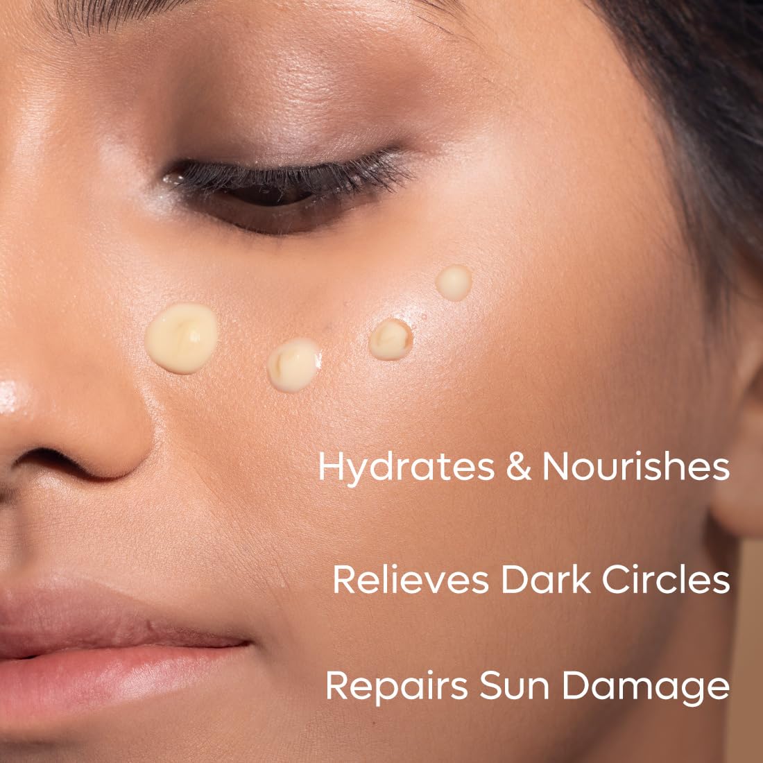 Close-up of a person's face with product application points, text indicating benefits.