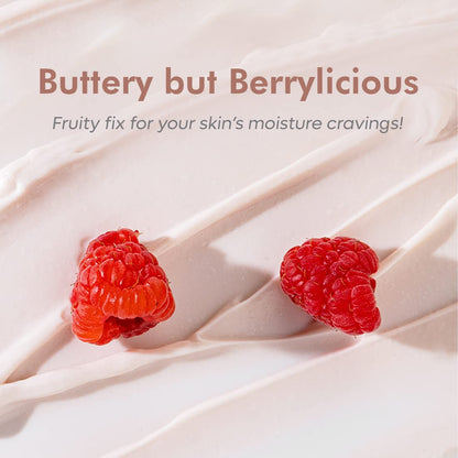 Two raspberries on a creamy background with text 'Buttery but Berrylicious' and 'Fruity fix for your skin's moisture cravings!'.