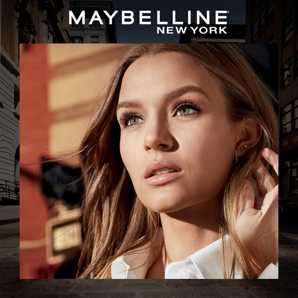 Maybelline New York advertisement featuring a woman with makeup in an urban setting