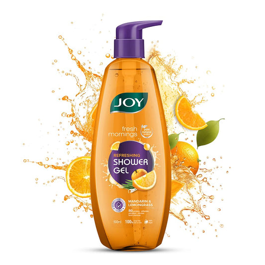 Orange shower gel bottle with purple pump and orange slices on a white background