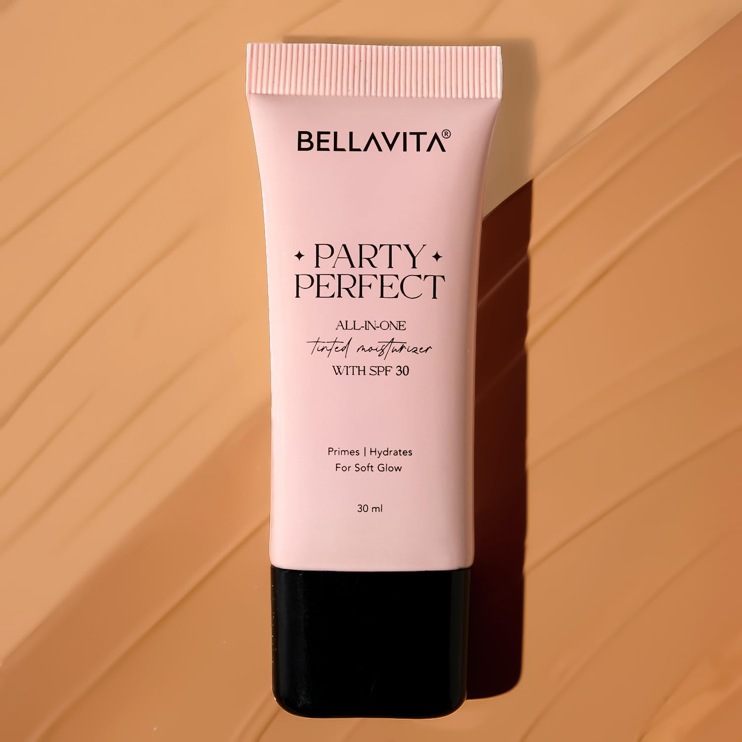 Bellavita Party Perfect skincare tube on a warm brown background