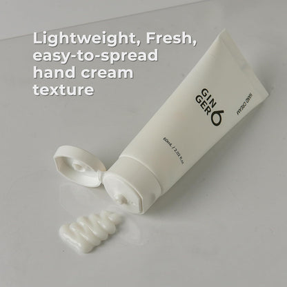 White hand cream tube with text on a light gray background