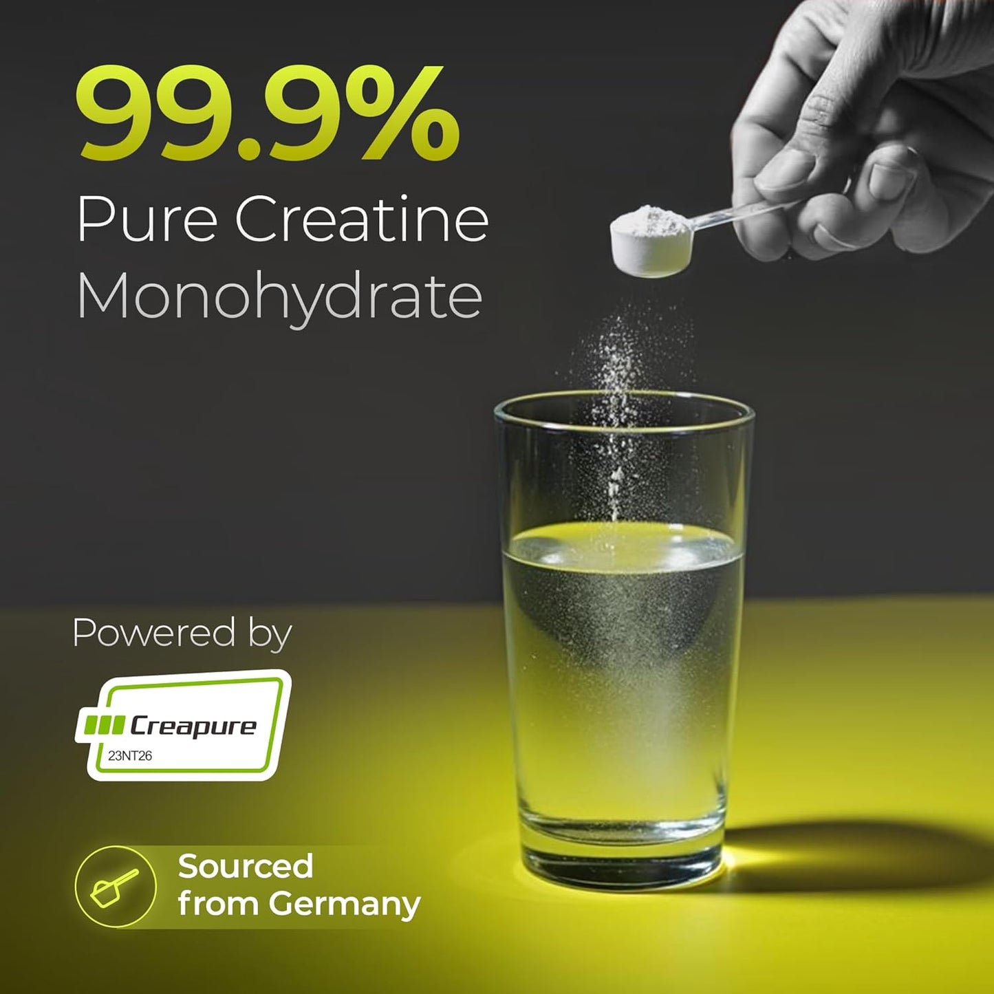Hand adding creatine monohydrate powder to a glass of water with promotional text about purity and origin.