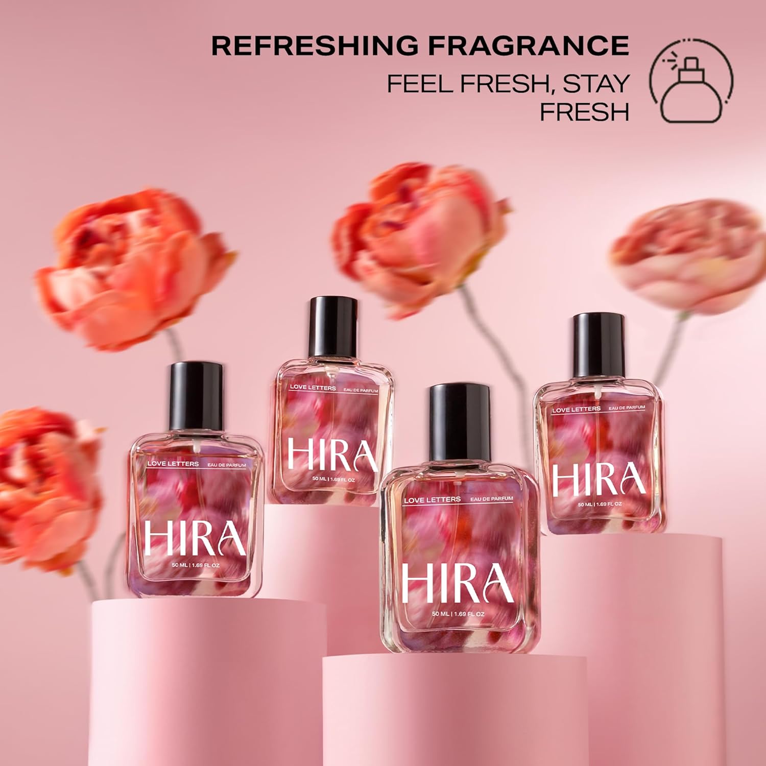 HIRA perfume bottles with flowers on a pink background