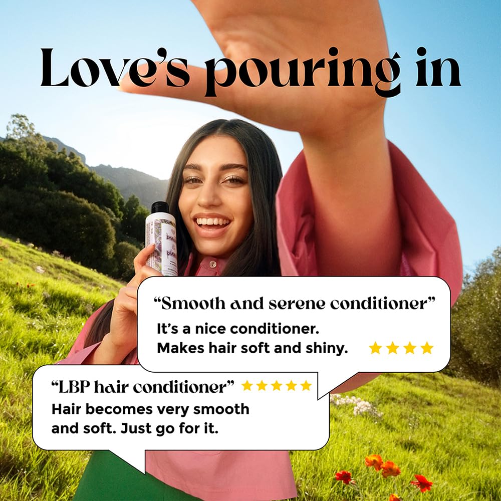 Woman holding a bottle of hair conditioner with text about its benefits in a scenic outdoor setting.