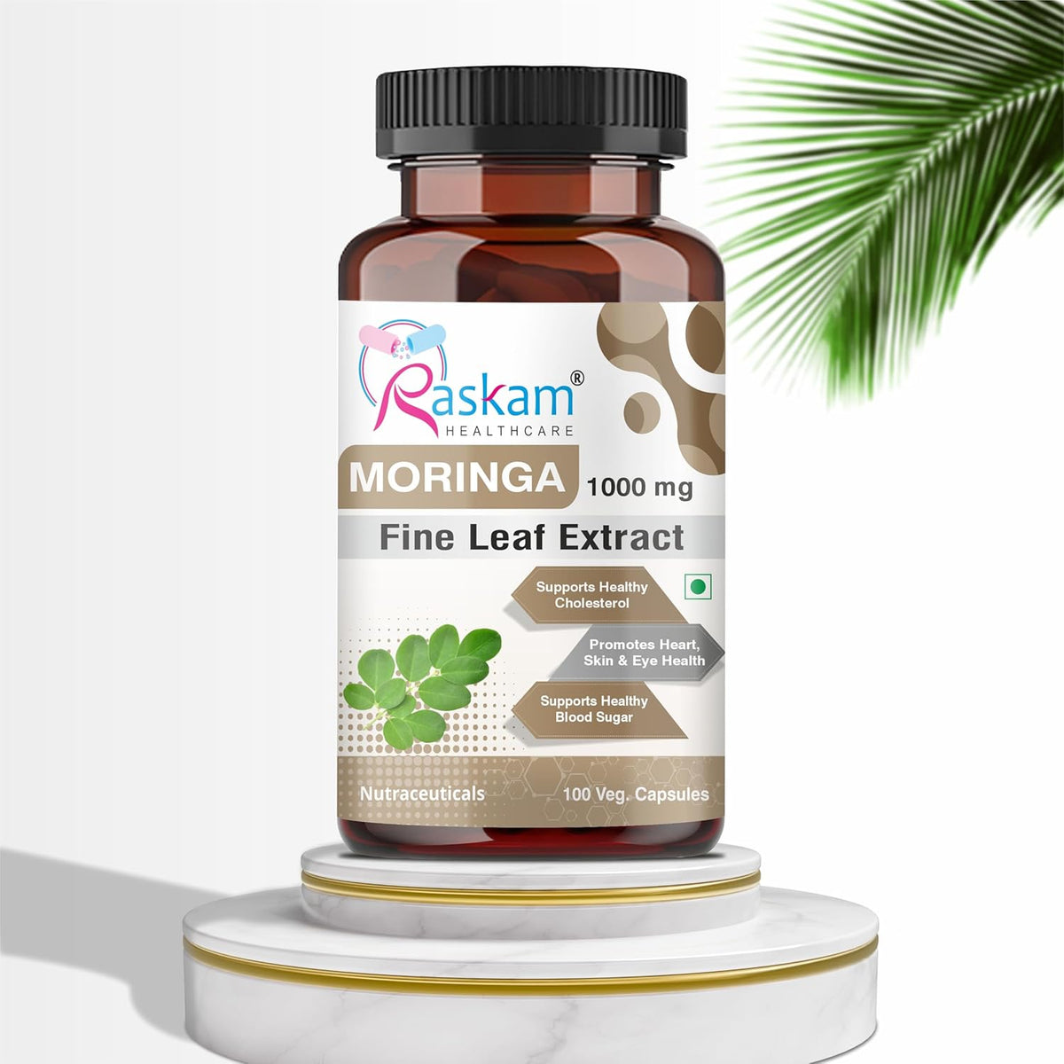 Bottle of Raskam Moringa Fine Leaf Extract on a white background with a palm leaf.