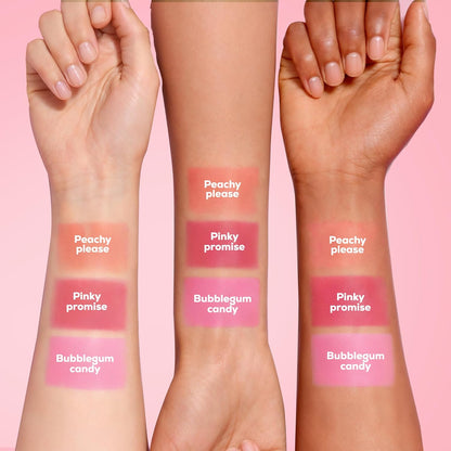 Three swatches of pink lip gloss on different skin tones with labels on a pink background