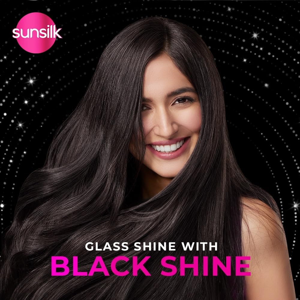 Sunsilk hair product advertisement with a woman with long, shiny black hair against a starry night sky background.
