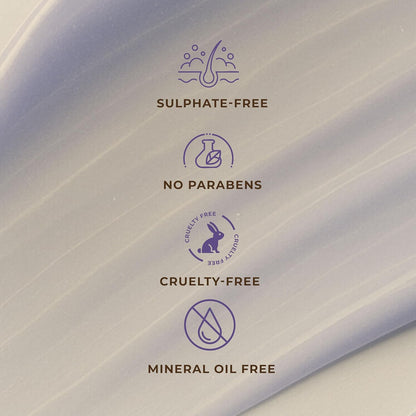 Product packaging with sulfate-free, no parabens, cruelty-free, and mineral oil-free labels on a gray background.