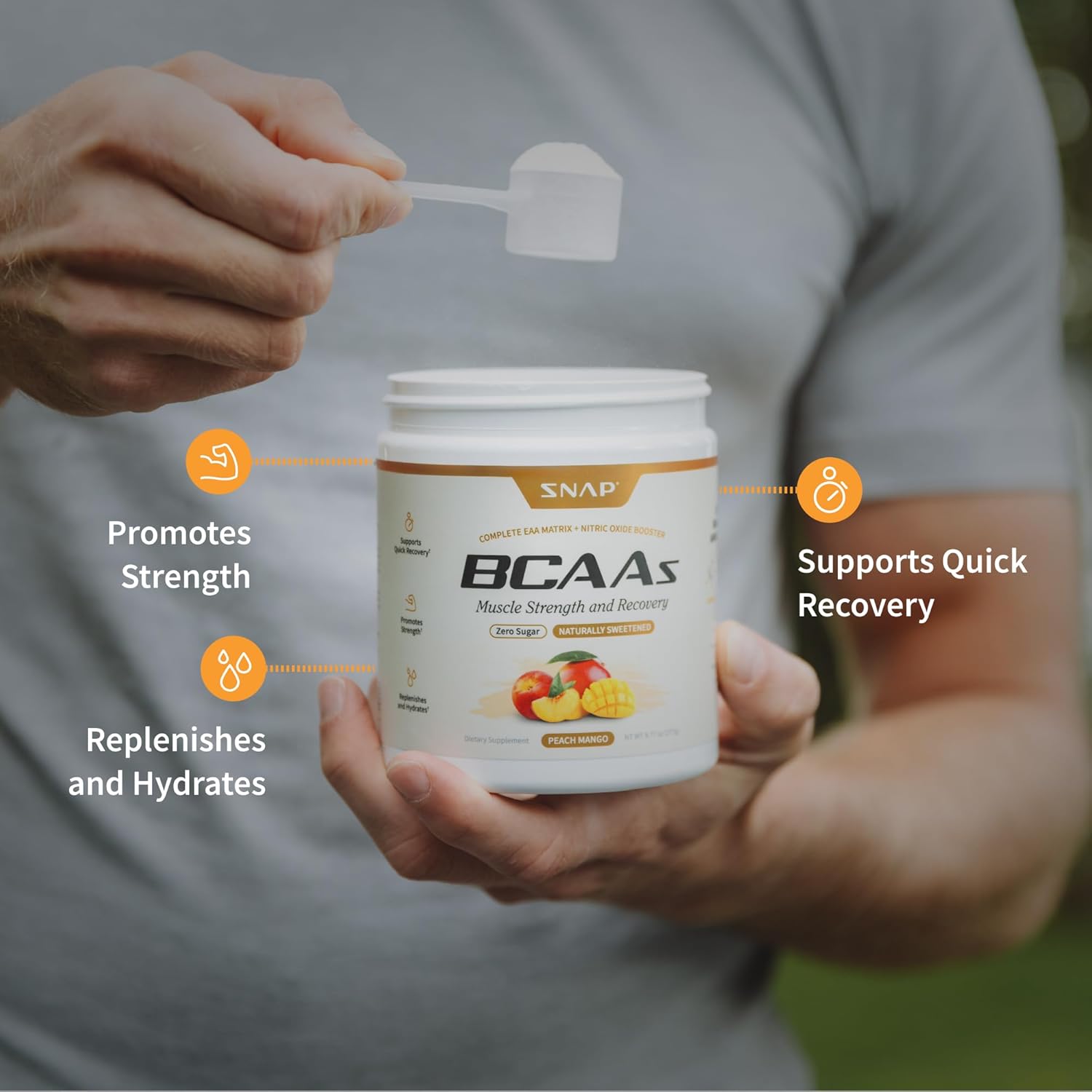 Person holding a container of SNAP BCAAs supplement with text highlighting benefits.