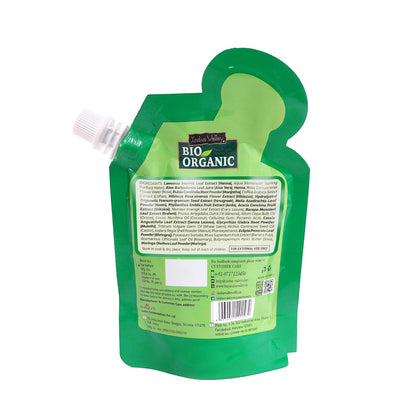Green organic product packaging with visible branding on a white background