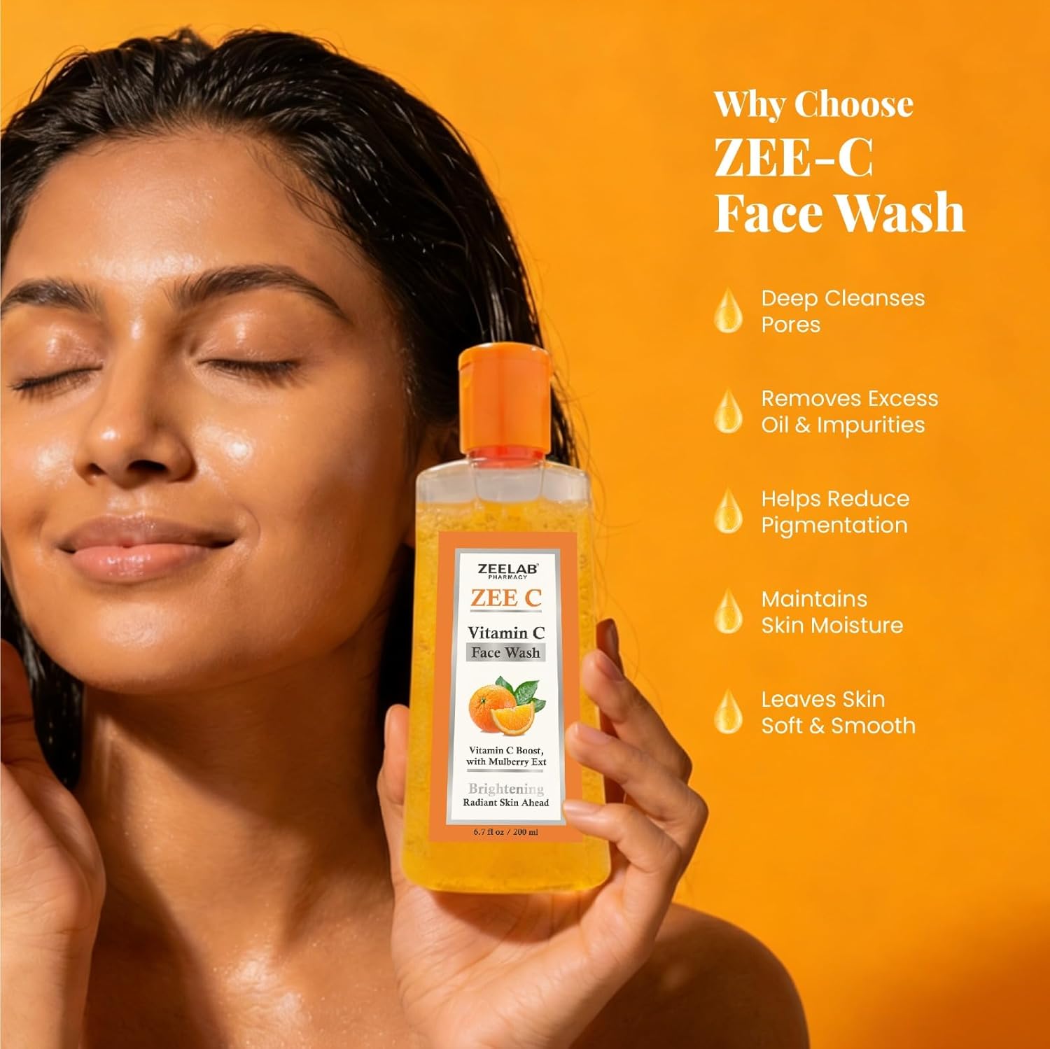 Woman holding ZEE-C Vitamin C Face Wash with product details on an orange background
