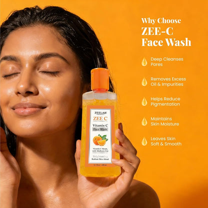 Woman holding ZEE-C Vitamin C Face Wash with product details on an orange background