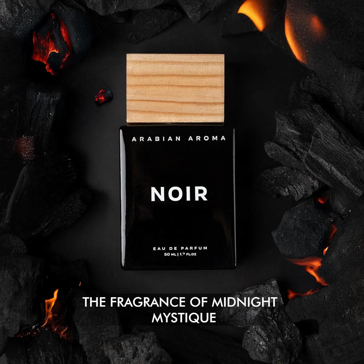 Perfume bottle labeled 'Arabian Aroma Noir' surrounded by dark elements with fire.