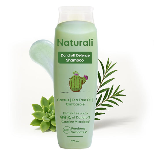 Green shampoo bottle labeled 'Naturali Dandruff Defence Shampoo' with plant elements on a white background