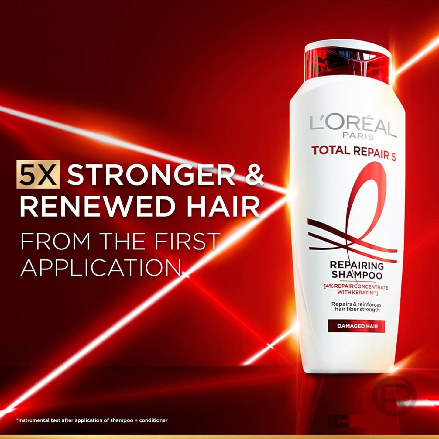 L'Oreal Total Repair 5 shampoo bottle on a red background with text about hair strength.