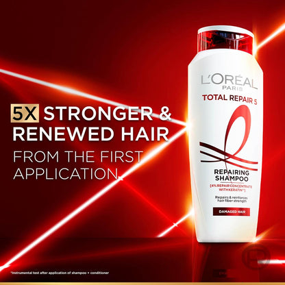 L'Oreal Total Repair 5 shampoo bottle on a red background with text about hair strength.