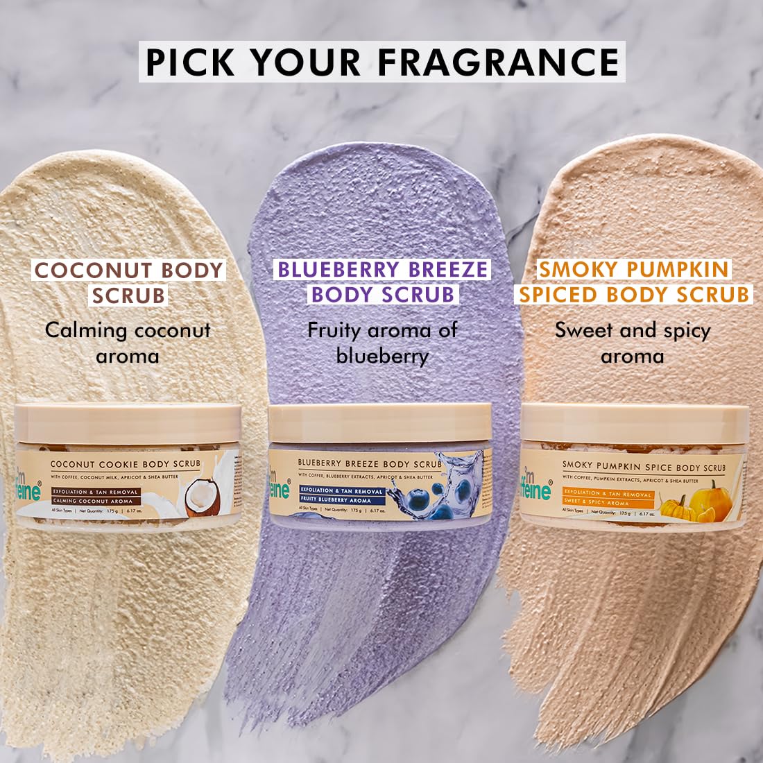 Three body scrubs with labels for fragrance and aroma on a marble background
