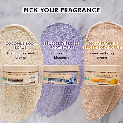 Three body scrubs with labels for fragrance and aroma on a marble background