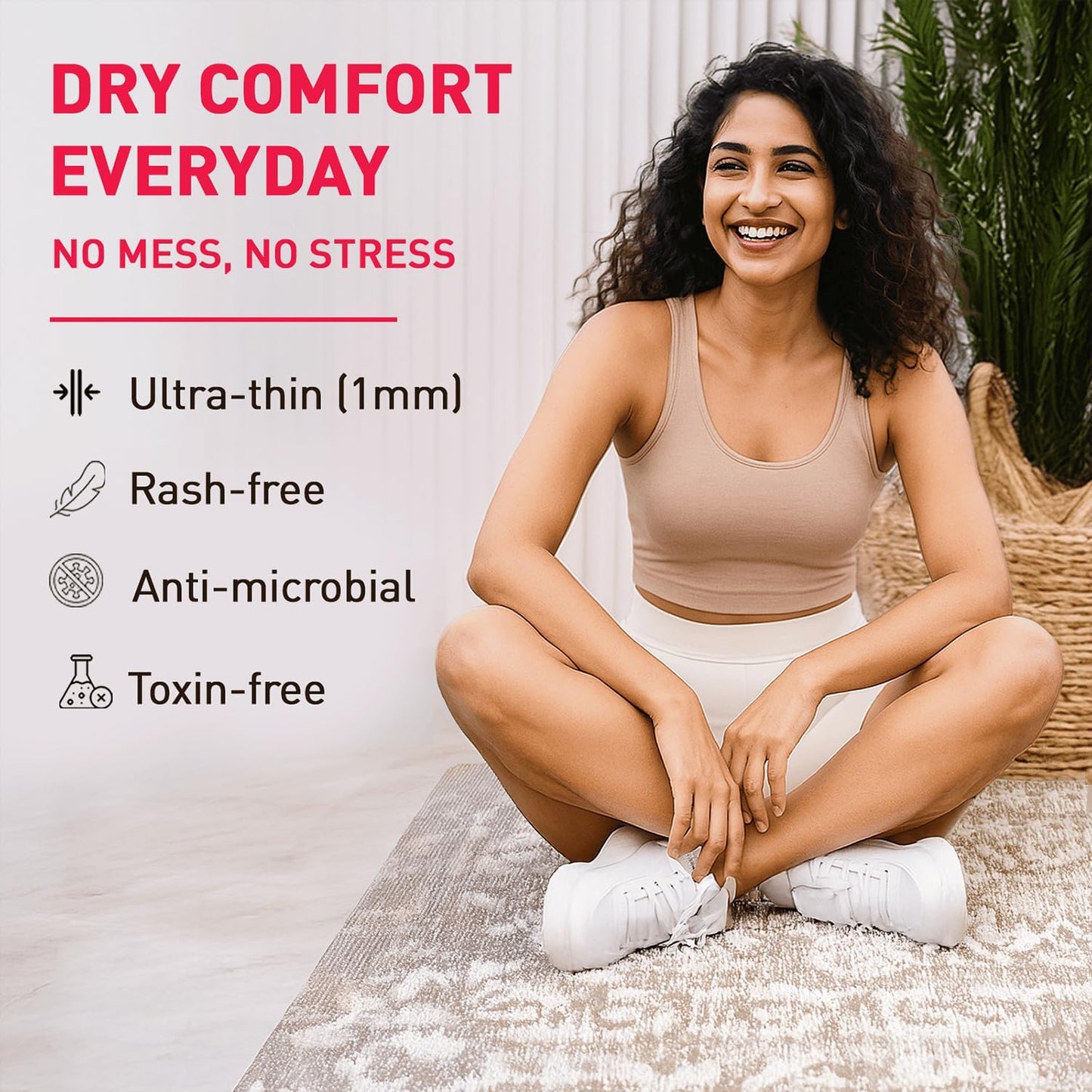 Woman sitting on a rug with text about dry comfort products