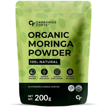 Green package of Carbamide Forte Organic Moringa Powder on a white background