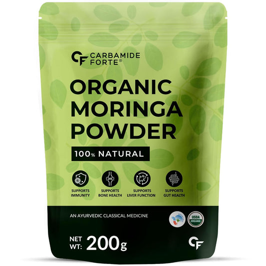 Green package of Carbamide Forte Organic Moringa Powder on a white background
