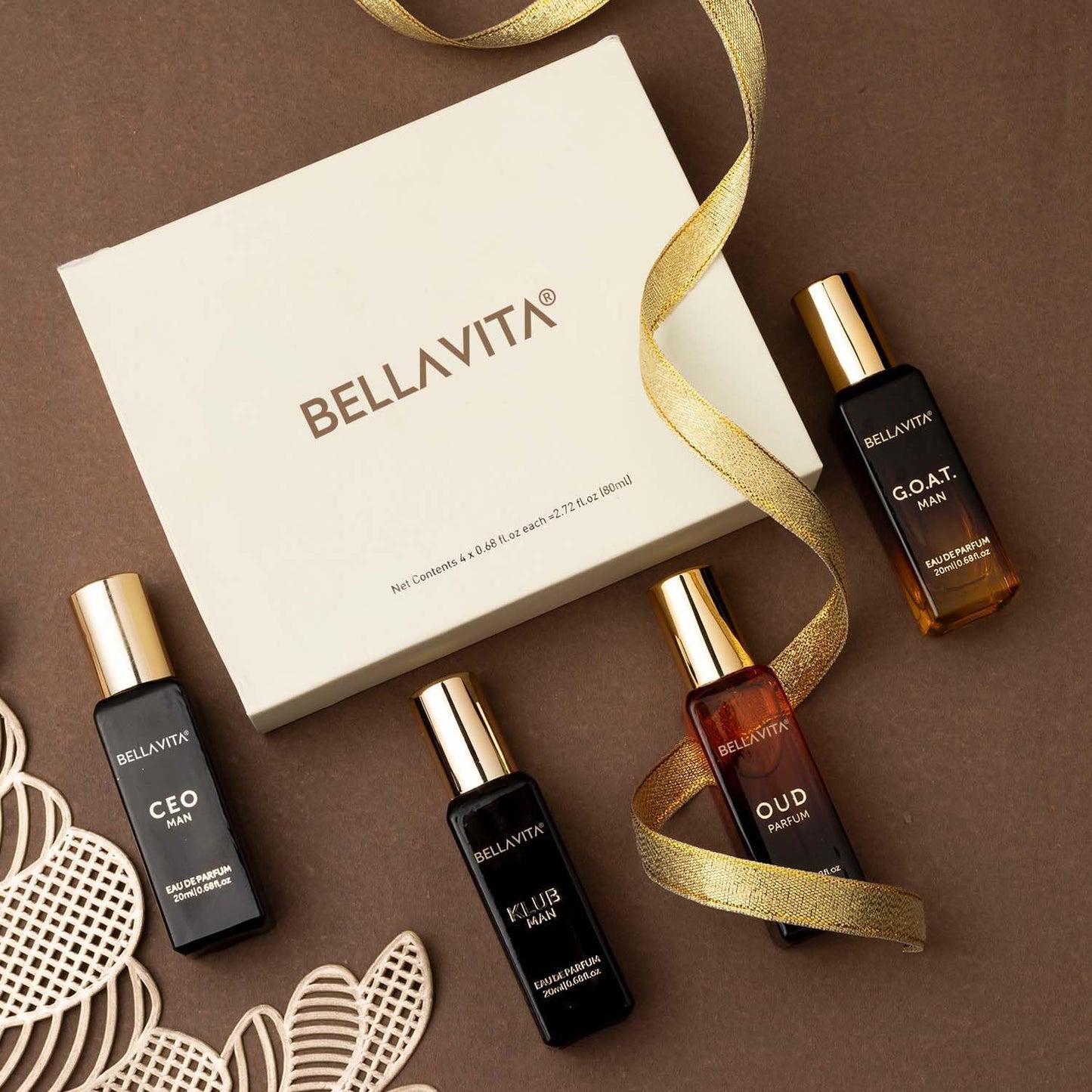 BellaVita perfume bottles with a gold ribbon on a brown background