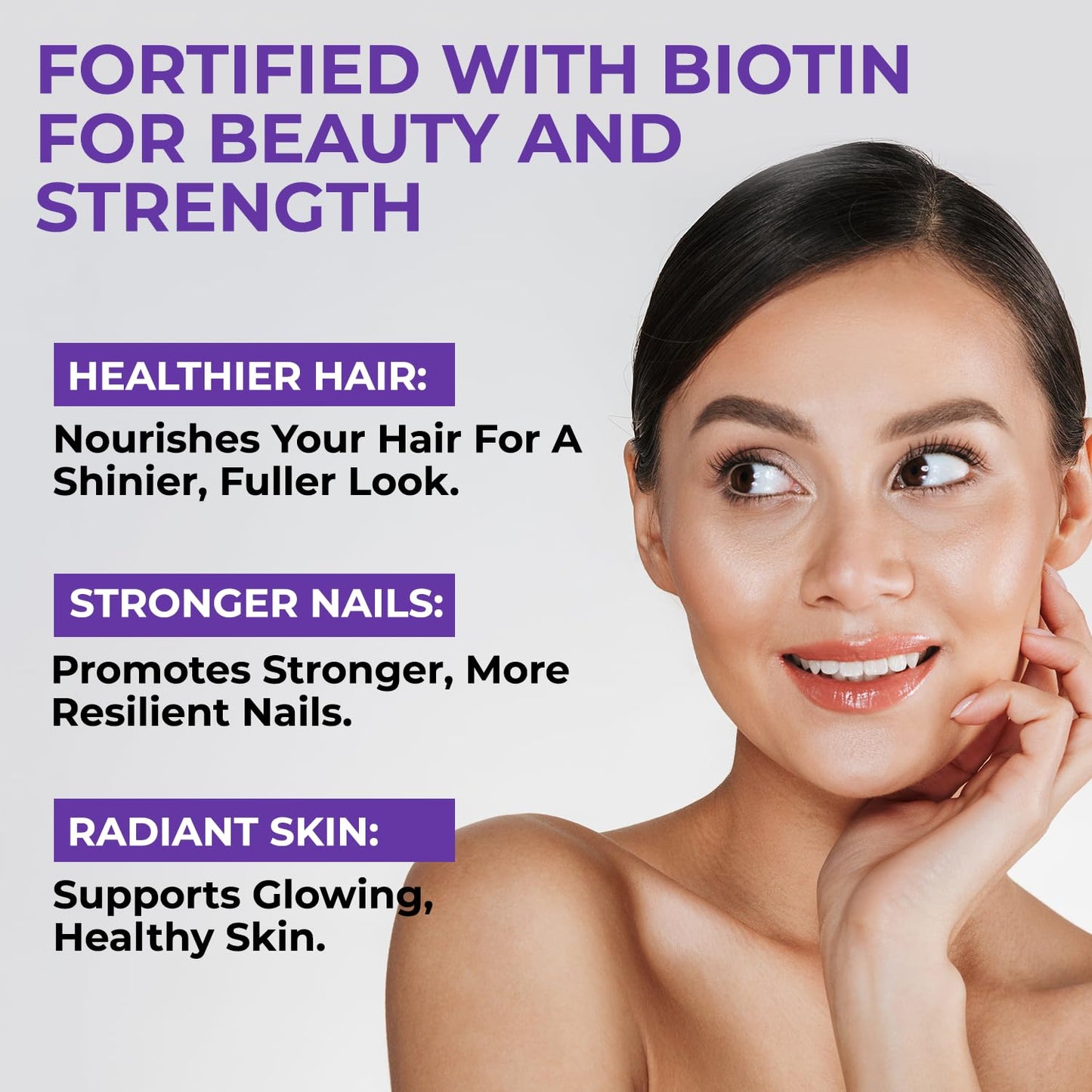 Advertisement for a product fortified with biotin, featuring a woman's face and text about hair, nails, and skin benefits.