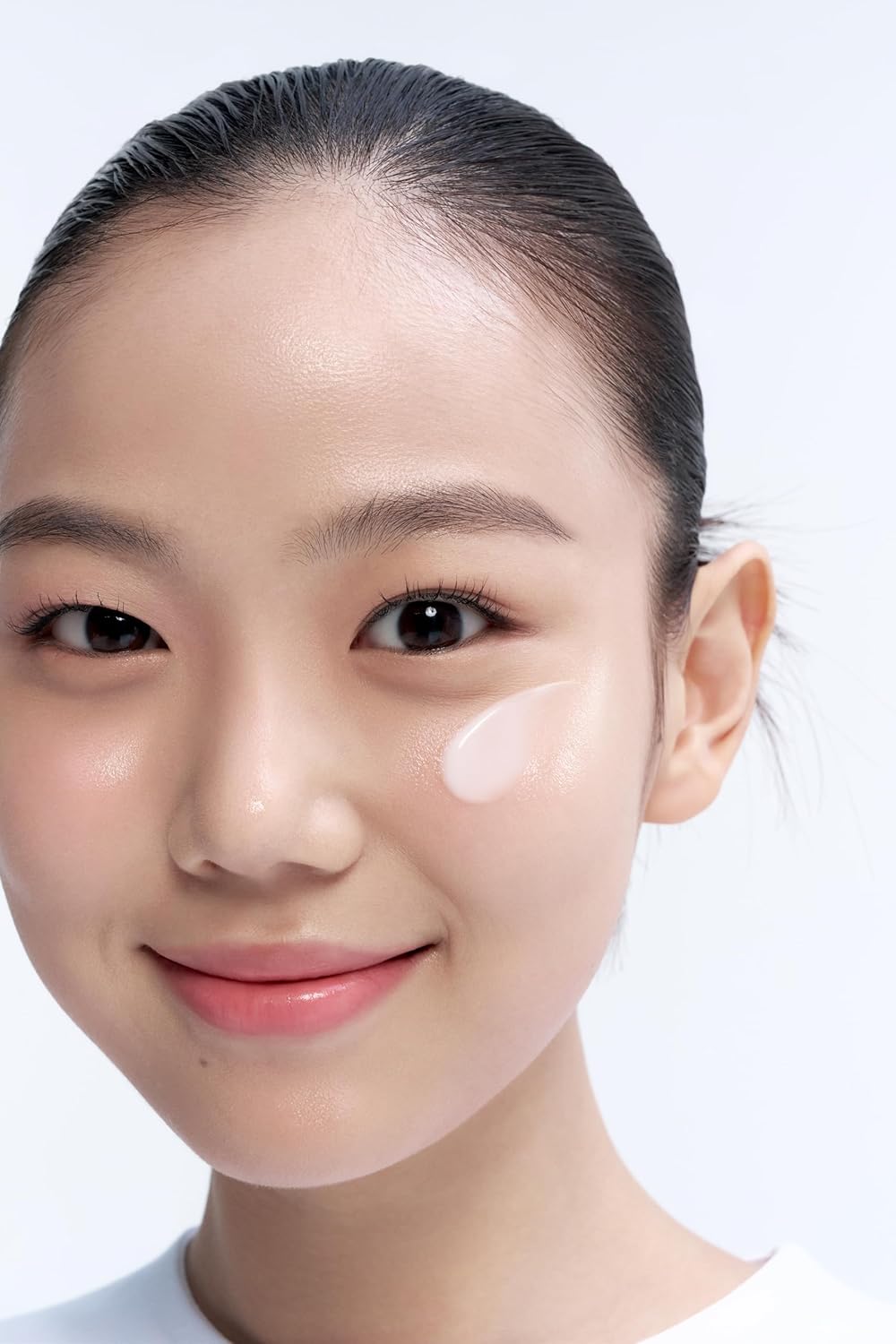 Close-up of a person with a plain background