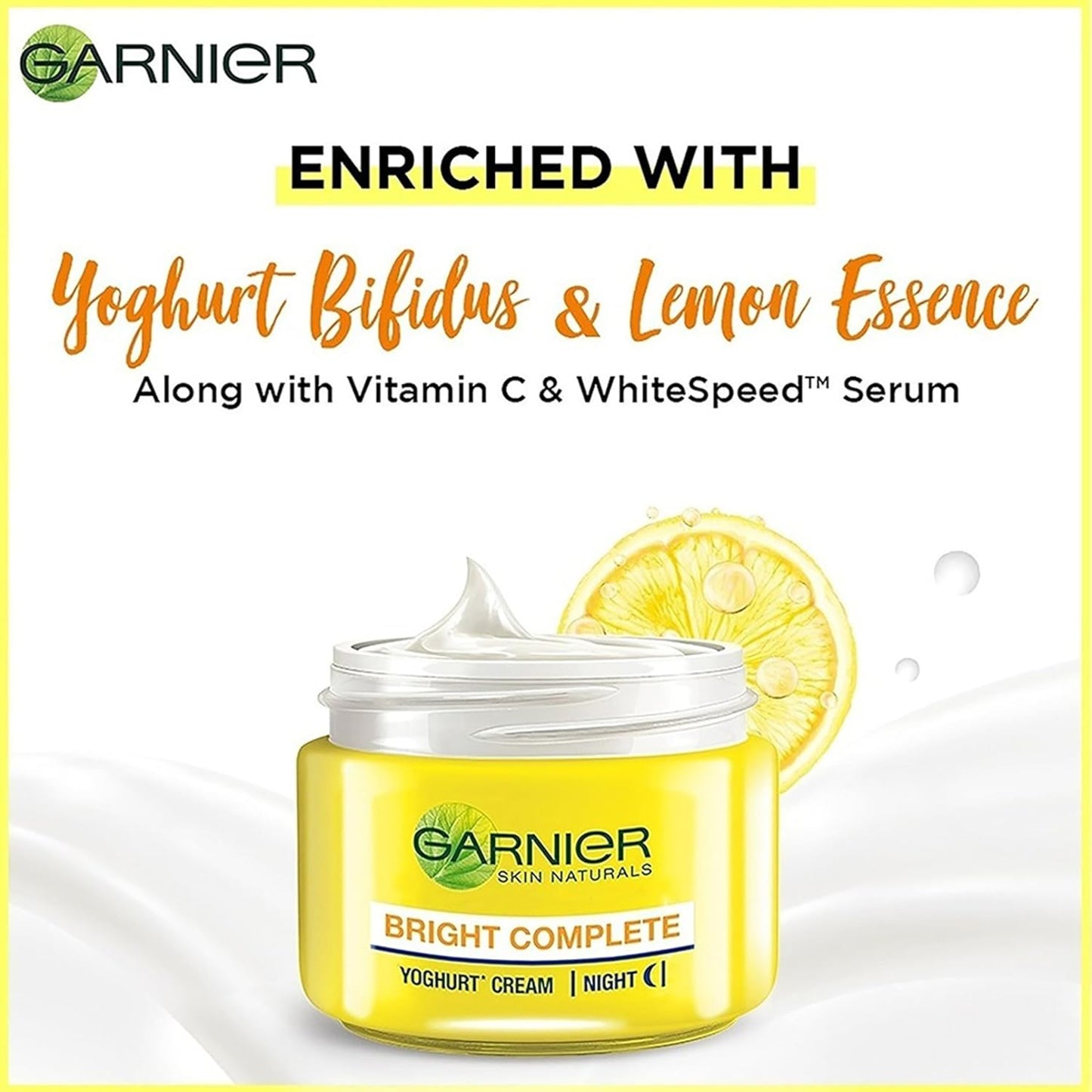 Garnier Bright Complete Yoghurt Cream jar with lemon slice on a white background