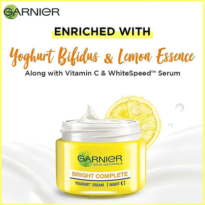 Garnier Bright Complete Yoghurt Cream jar with lemon slice on a white background