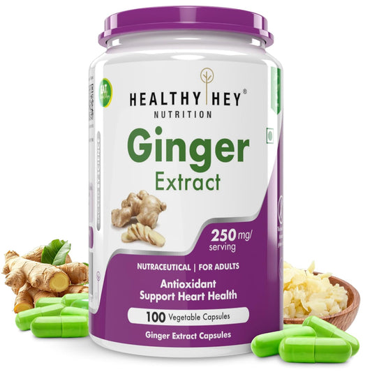 Container of Healthy Hey Nutrition Ginger Extract capsules with ginger roots and capsules on a white background