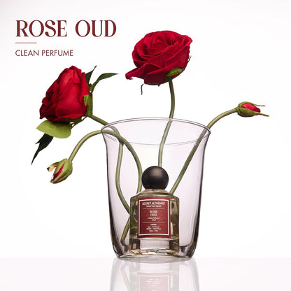 Perfume bottle with red roses on a white background