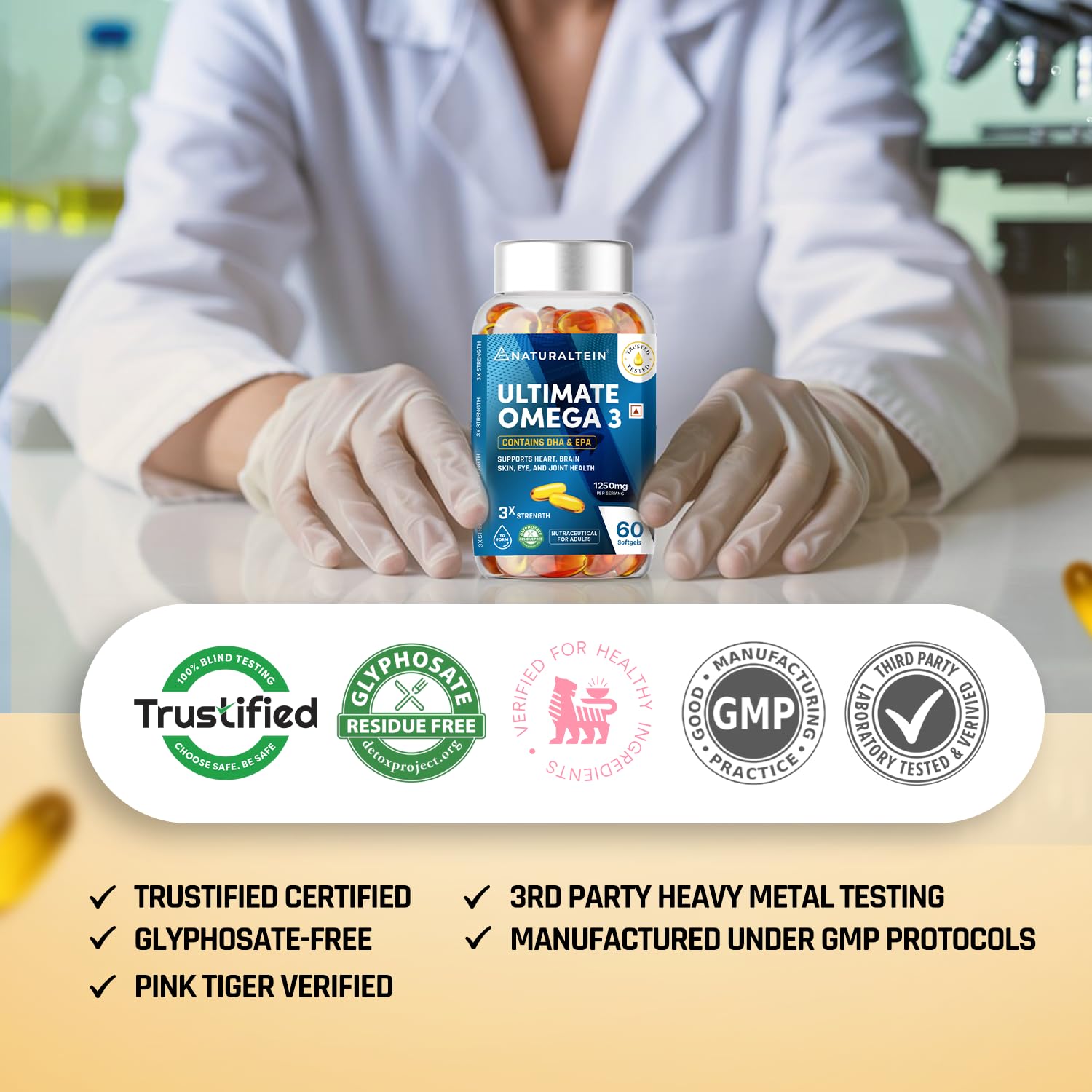 Person holding a bottle of 'Ultimate Omega 3' with certification logos at the bottom.