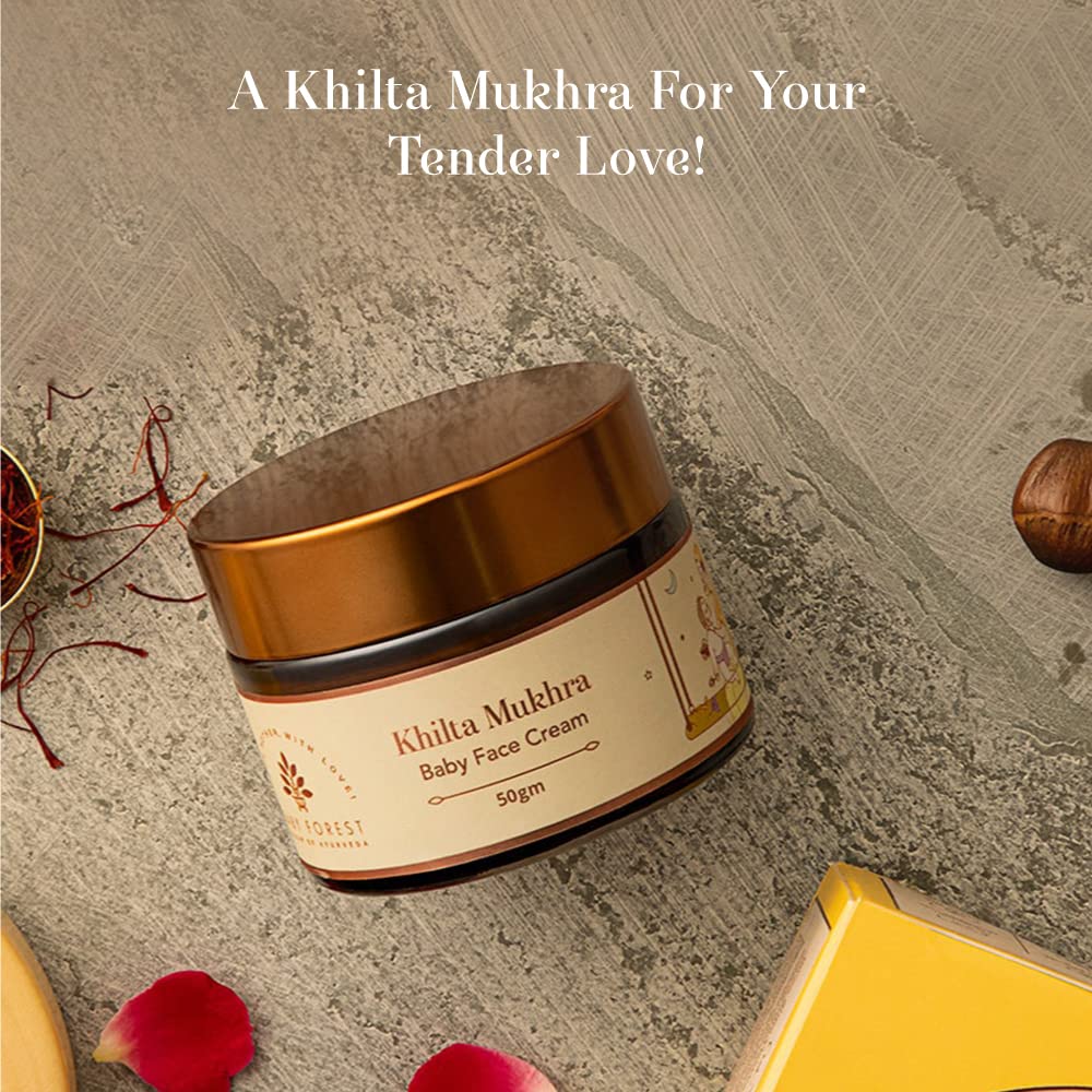 Khilta Mukhra baby face cream jar on a textured surface with decorative elements.