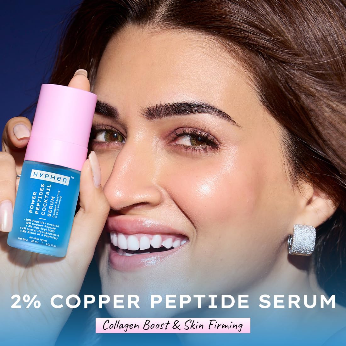 Woman holding a bottle of 2% Copper Peptide Serum with a blue background