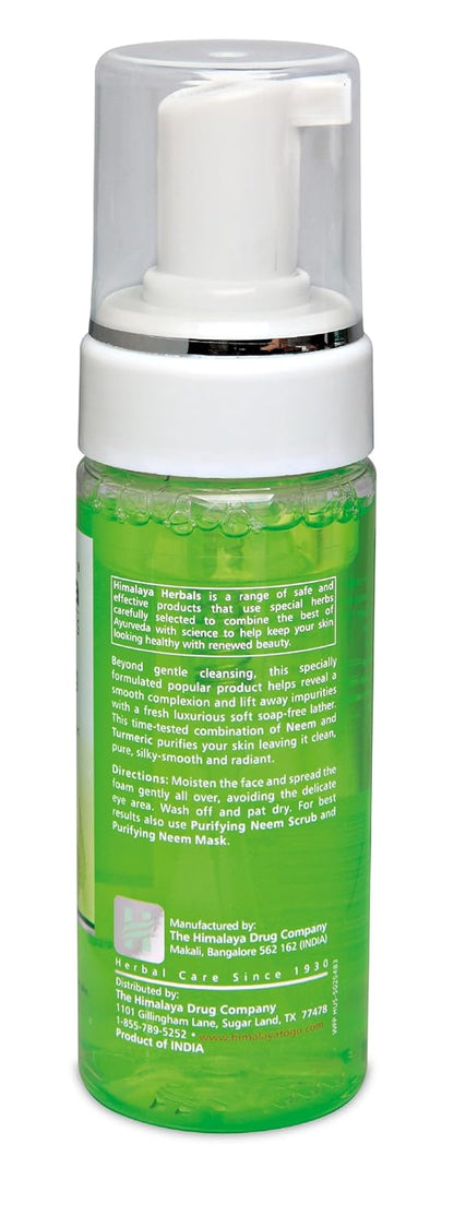Green bottle with white pump on a white background