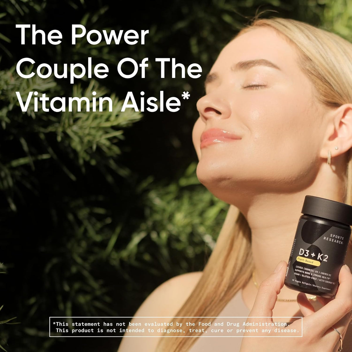 Woman holding a supplement bottle with text about vitamins