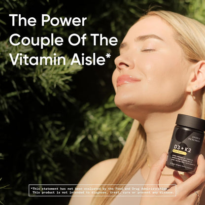 Woman holding a supplement bottle with text about vitamins