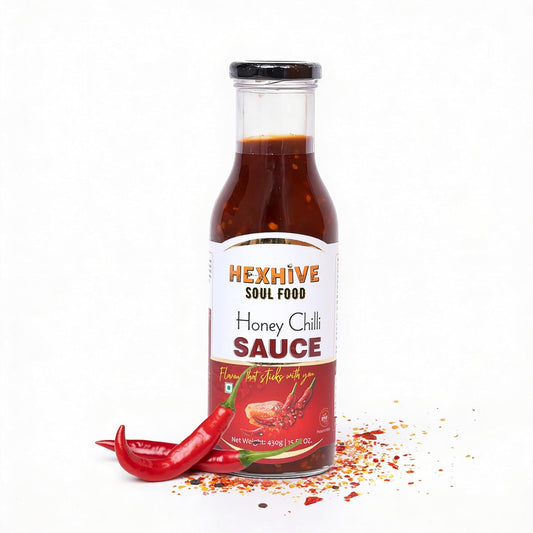 Bottle of Hexhive Honey Chilli Sauce with a red chili pepper on a white background