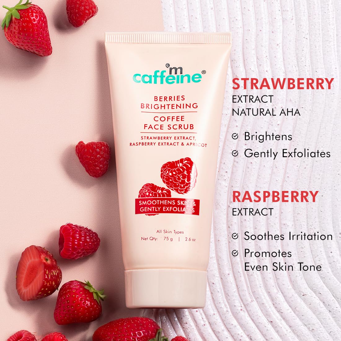 Caffeine berries brightening coffee face scrub with strawberries on a light pink background