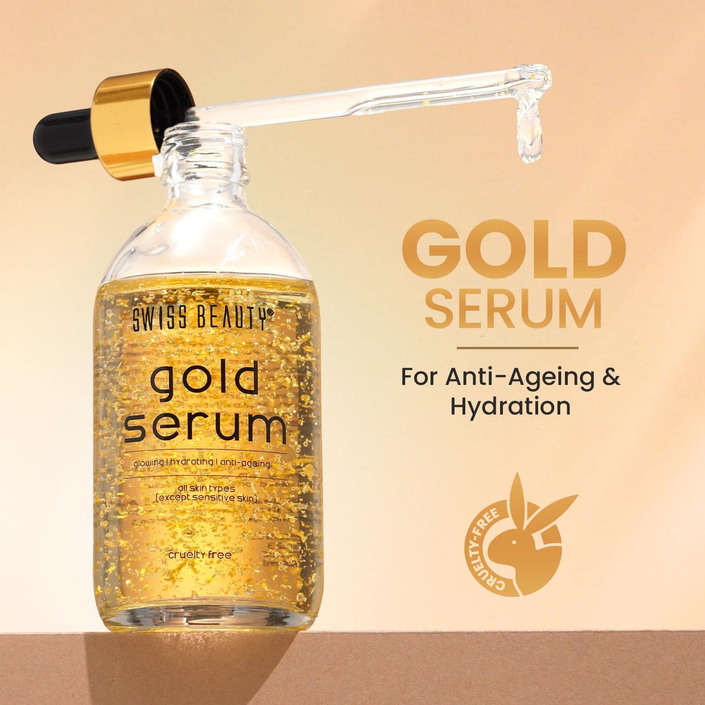 Gold serum bottle with dropper on a beige background