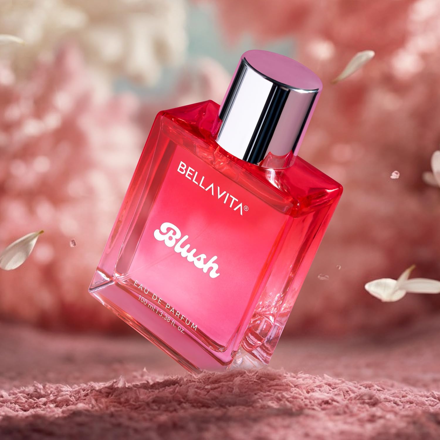 Pink Bellavita Blush perfume bottle with floral background