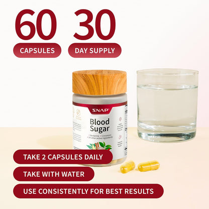 Supplement jar labeled 'Blood Sugar' with capsules and a glass of water on a beige background.
