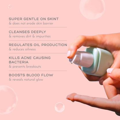 Hand holding a skincare product with text about its benefits on a pink background