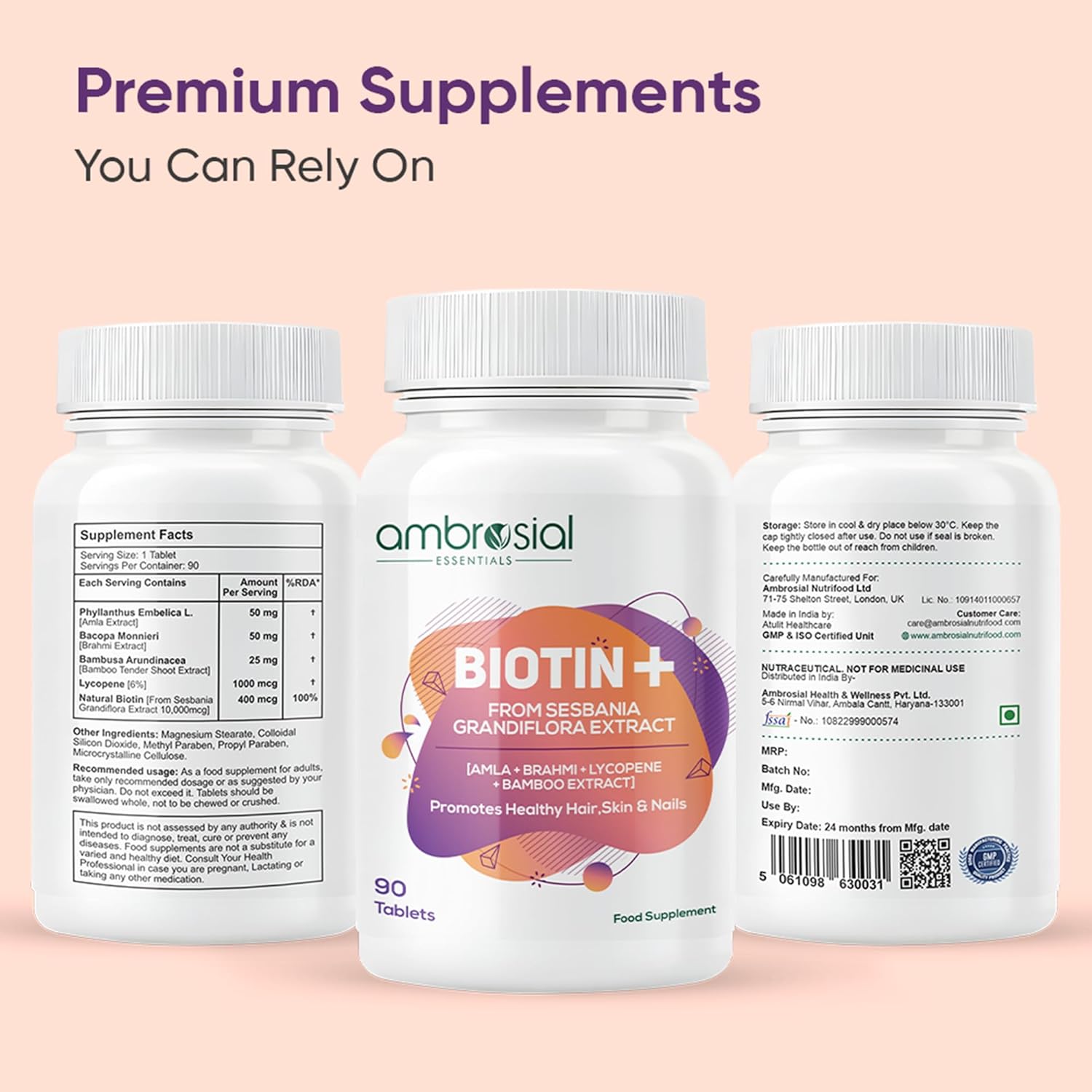 Three bottles of Ambrosial Biotin+ supplement on a pink background with text about premium supplements.