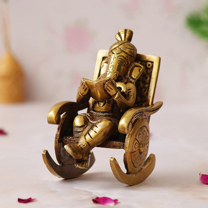 Golden Brass Handcrafted Lord Ganesha Statue Sitting on a Chair and Reading a Book Decorative Showpiece | Divine God Idol for Home, Office Decor, and Gifts
