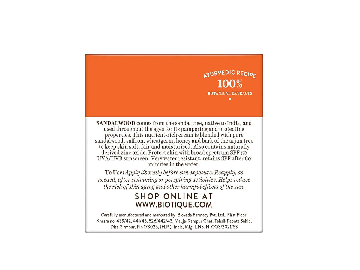 Product label with sandalwood information and Biotique branding on an orange and white background